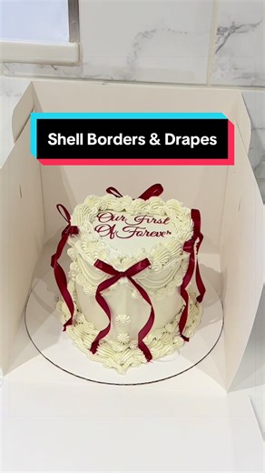 Decorating a 4” heart red velvet bento ❤️ Filled with cream cheese frosting, finished with top & bottom shell borders, reverse shells, intricate side drapes and double drop lines 🤍 Completed with pearl lustre dust, white pearl sprinkles and red bows, vintage perfection ❤️ #RedVelvetCake #HeartBento #VintageCake #CakeTok #HalalCakesCoventry
