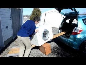 Unloading a washer from a car, alone