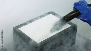 Filling styrofoam box with liquid nitrogen, preparing for ivf cryogenic preservation procedure