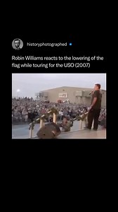Footage from Robin Williams' 2007 USO tour in Kuwait captures the moment his stand-up routine was interrupted by the military's flag-lowering ceremony. Respectfully removing his hat and pausing his act for the duration, he later eased the tension with an immediate, perfectly timed joke about the sudden interruption. | History In Pictures