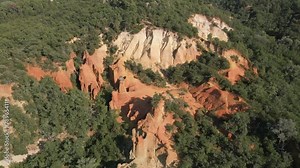Aerial footage of Red sands and abstract Rustrel canyon moher cliffs landscape. Provencal Colorado near Roussillon,in the Vaucluse department - Southern France.
