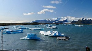 Jokulsarlon glacier and icebergs floating in the lagoon, one of the most touristic spots in Iceland.