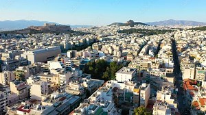 Acropolis city of Athens parthenon, symbol of ancient Greece, Mount Lycabettus, Parliament Building, residential buildings. Ancient greek temple ruins, Erechtheion. Beautiful morning in Athens.