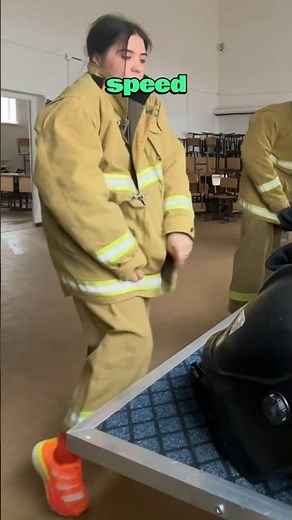 Six Firefighters Compete In A Suit Up Race