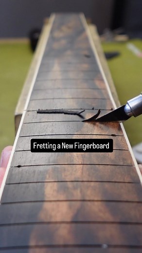 14K views · 4K reactions | I bought this shower cheap guitar to turn into one that will actually be nice to play, and now I'm getting the fingerboard glued on and the frets installer. This is all in the name of learning- I've never done a fingerboard replacement before. Thank you to @stewmac_guitar for providing the supplies for this project! Do you like the inlays? #guitar #bass #fender #gibson #stratocaster | Emerson N'Dea | Facebook