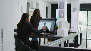 Architect reviewing residential area building plans on pc, working with interactive screen to design and outline property elements. Technician preparing for project in startup coworking space.