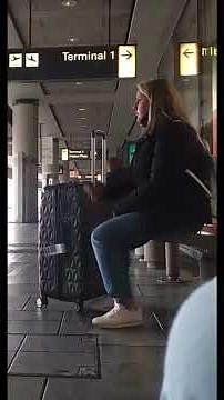 Girl smoking candidly at the airport