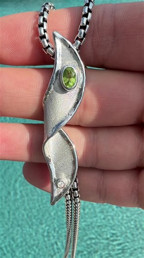 This pendant is crafted in solid 950 silver, set with a natural diamond and a vibrant peridot. Designed by me and created by a master jeweler in Greece. #dawodandco #greece #jewlery #peridot #silver