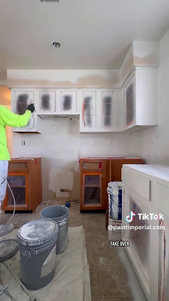 Spraying Sherwin-Williams Extreme Bond Primer on Cabinets