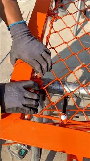 Carefully Installing a Safety Net onto a Metal Frame Using Hand Tools for Secure Support #shorts