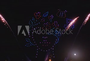 Flying drones creating 3d models moving on night sky