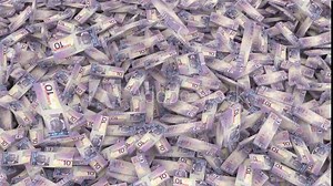 ten Canadian dollars stacks of banknotes fall from above forming a large pile on the whole screen