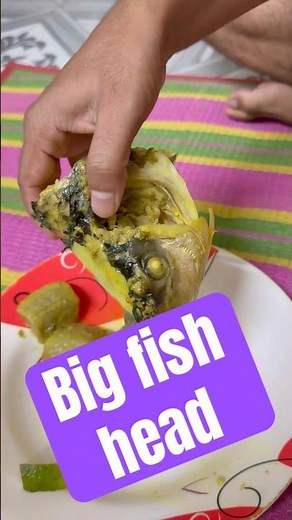 Eating fish head traditional food.