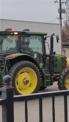 The John Deere 6105M tractor used for farming and other industries, and livestock farming.