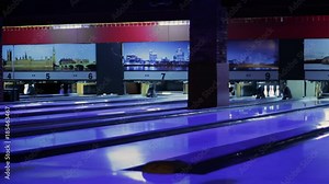Modern Colorful bowling alley. Group game. Bowling strike competition. Spacious hall with a lot of game tracks