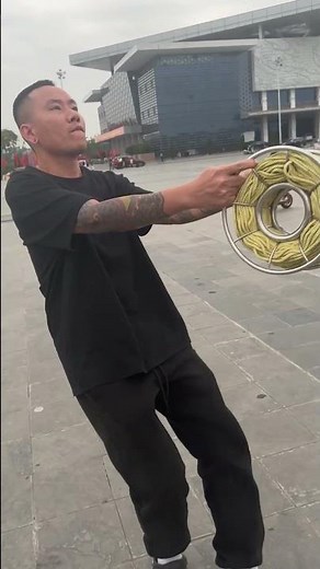 My brother is flying a kite, getting ready to run it. #layangan #patang #kiteflying #pipas #uçurt...