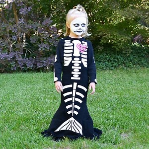 Make a DIY skeleton mermaid costume with iron-on vinyl and a black dress to refashion. It's a creepy cute costume that's so fun! https://www.heatherhandmade.com/diy-skeleton-mermaid-costume/ | Heather Handmade