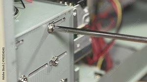 repair a personal computer: disassemble a computer: unscrew a support screw