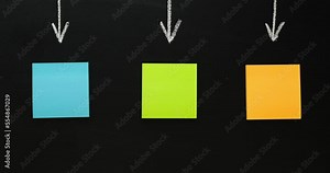 Multi-colored note paper with an arrows on a black background. Process concept with a place for your text. 4K stop motion animation