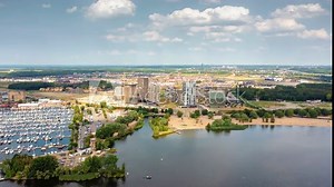 Almere Poort - new residential neighborhood in Almere, Flevoland, The Netherlands with its luxury appartment buildings and marina. Aerial hyperlapse.