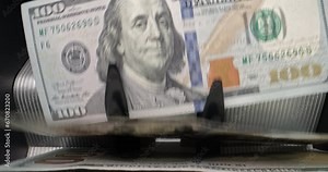 Dollar bills banknotes counting machine. Banking automatic equipment for counting paper money. Close Up Cash Counting Equipment. Indispensable tool in business, commercial activity and banking.