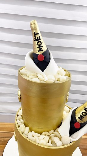 18K views · 1.2K reactions | “1 of 3” for #Adey@50  …. Stacked ice bucket cake with MOET champagne bottle detail.. It’s giving “Luxury” with a touch of class | Oven Secret | Facebook