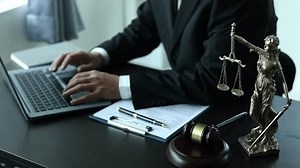 clip-1104108969-court-justice-judicial-male-lawyer-writes-argument