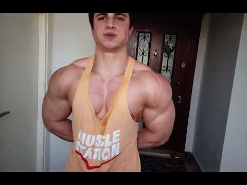 The Super muscular man flexing his biceps.