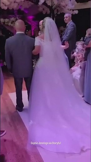 Bride sings herself down the aisle