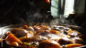 Cooking stewed fruit. Slow motion. Compote cooks in a pan.