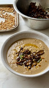 Meet @christinasots, the newest member of our Ottolenghi Test Kitchen. Her first dish is a creamy mushroom soup with sticky ras el hanout mushrooms on top. Perfectly autumnal, entirely plant-based (just like Christina). The creaminess comes from pine nuts simmered until soft, and those mushrooms on top – roasted with ras el hanout, soy, and maple syrup – get sticky, almost jammy. More about Christina in stories, recipe through the link in bio. | Ottolenghi