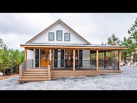 Modern Farmhouse with Spacious Wrap-around Deck Amidst Peaceful Surroundings