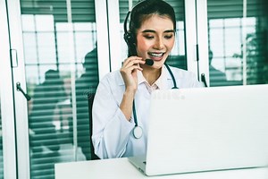 Doctor Wearing Headset Talking Actively on Video Call in Hospital or Clinic Stock Image - Image of conferencing, consulting: 244310333