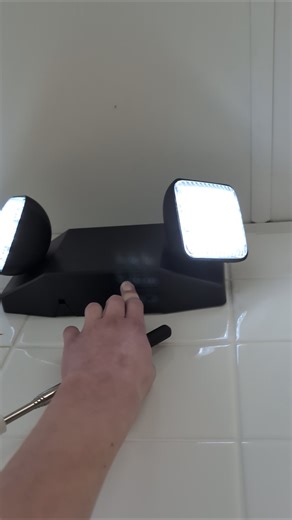 Testing a Hubbell CU2SQ emergency light in black housing