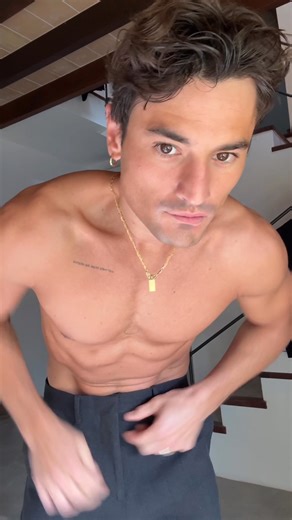 Jonas Kautenburger gets ready for a night out. Eyes on the tailored pants and classic button down shirt for a monochromatic look. | Calvin Klein