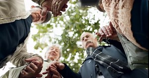 Nature, holding hands and senior people praying for religion, worship or spiritual belief. Hope, group and elderly friends with prayer together for retirement blessing or gratitude in park from below