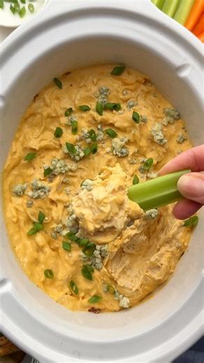 This Crockpot Buffalo Chicken Dip requires only five basic ingredients, 10 minutes of prep, and your trusty slow cooker! | The Recipe Rebel