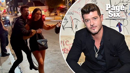 Watch drunken Robin Thicke stumble out of bar, grab embarrassed fiancée as she begs him to stop