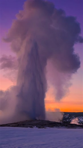 Kevin League Fine Art Photography on Instagram: "In the cold air after sunset, Old Faithful becomes pure physics on display. Water heated far beyond its normal boiling point races upward when pressure gives way, erupting at tremendous speed and climbing more than a hundred feet into a frozen, violet sky. Steam blooms, droplets flash toward ice, and gravity slowly reclaims what the Earth just released. . A wonderful memory from our recent winter wonderland tour &workshop with Lisa Culpepper Photo