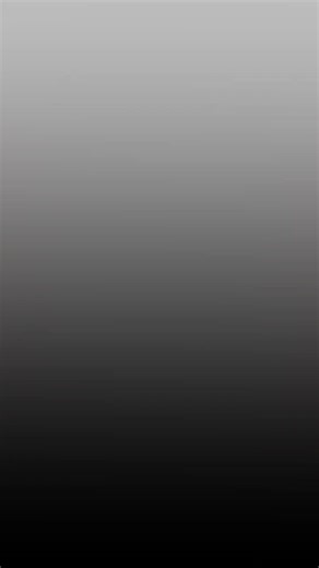 Prompt gemini: Buatlah foto ini tanpa merubah bentuk wajah aslinya, menjadi Seorang wanita sedang duduk di tepi tempat tidur besar di kamar tidur bertema rainbow ruby dengan warna pelangi/pink/krem. Dia melihat langsung ke kamare. Dia memiliki rambut panjang warna hitam yang tergerai. Dia mengenakan atasan dan celana panjang berwarna krem/pink/biru muda cerah bermotif gambar kartun rainbow ruby yang serasi. Dia memakai kalung emas berliontin kartun rainbow ruby, dia juga memakai anting emas mode