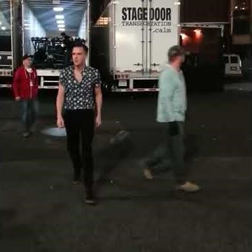 Brandon Flowers caught holding his wife's hand