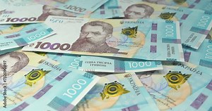 Ukrainian banknotes. Money of Ukraine. New banknotes 1000 Hryvnia in uncirculated condition, UNC. Real Ukrainian paper money of blue yellow color, UAH. Cinema 4K video