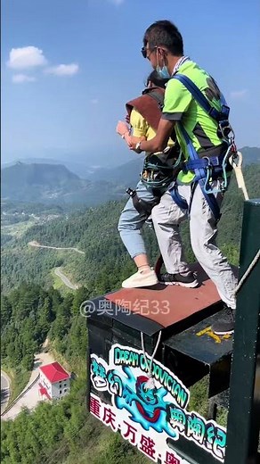 A young woman takes on a cliffside walkway 300 meters up in the air. #funny #adventure