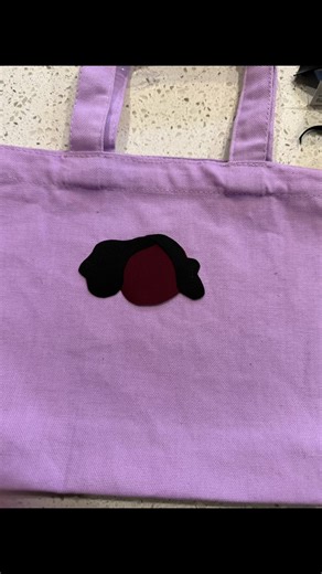 Using iron patches to collage on a canvas bag
