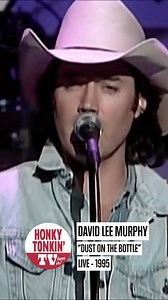 David Lee Murphy’s Dust on the Bottle hit country radio in 1995 and became an instant classic. With its laid-back groove and storytelling charm, the song tells of an old country boy giving advice about love, comparing it to a well-aged bottle of wine. It became Murphy’s first and only No. 1 hit, cementing his place in ‘90s country. Even years later, it remains a barroom staple and a go-to anthem for country fans who like their music with a little dust and a lot of soul. #country | HonkyTonkin'TV