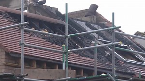 Fire crews tackle three-storey house fire