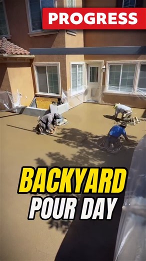 Backyard Concrete Pour in Action! The concrete is being poured and finished as the team works with precision to shape the backyard. Watch the construction progress and let us know what you think in the comments. #concrete #outdoormakeover #pouring #working #progress #backyardmakeover | Rivers Landscape Construction Inc.