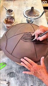 The technique of carving clay patterns with precision tools.