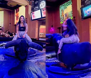 The Ultimate Rider: Pretty Asian Chick Was Having Fun Riding A Mechanical Bull For The First Time!