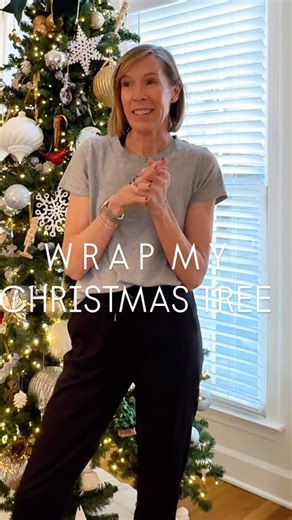 Mich on Instagram: "🎄WRAP MY TREE WITH ME🎄 It has probably been 10 years since I took all the ornaments off of my tree 🤪. I started wrapping our tree with moving/packing wrap and never looked back. Granted, I don't have a lot of delicate ornaments so I feel comfortable doing this! If an ornament falls in transport to the garage, the wrap typically catches it. As we unwrap it the following year I will fluff the branches and rehang anything that came loose. This could be genius or just plain la
